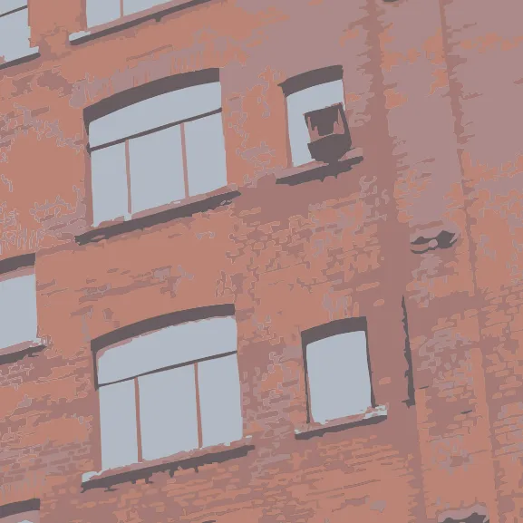 Ausschnitt der Fassadenansicht der Tabakfabrik, rote Ziegel und Fenster.