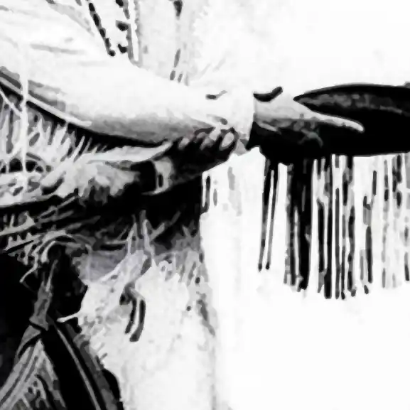 Stilisierter Ausschnitt eines Schwarz-Weiß-Fotos zeigt den Handschlag zweier Männer auf Pferden. Einer ist als „Indianer“ gekleidet, der andere als „Cowboy“.